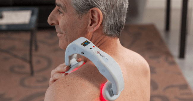 a man treating his shoulder pain