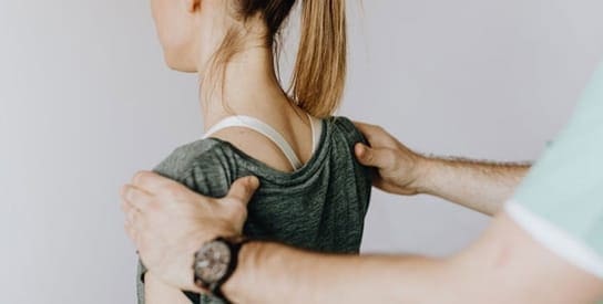 Practitioner preparing patient for non-invasive LLLT device treatment